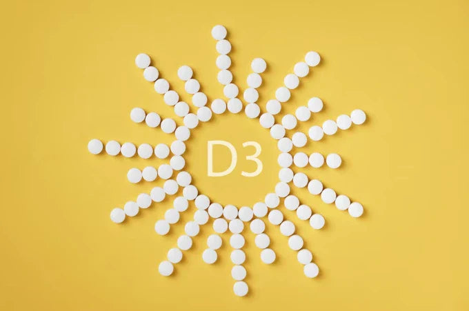 White tablets forming a sun shape with "D3" in the center, representing Vitamin D3 for preventing advanced cancer.