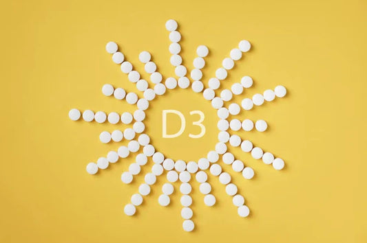 White tablets forming a sun shape with "D3" in the center, representing Vitamin D3 for preventing advanced cancer.